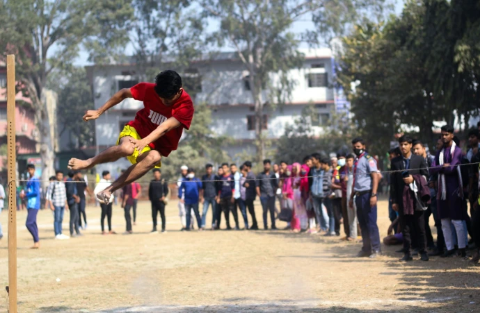 a man flying through the air while riding a skateboard